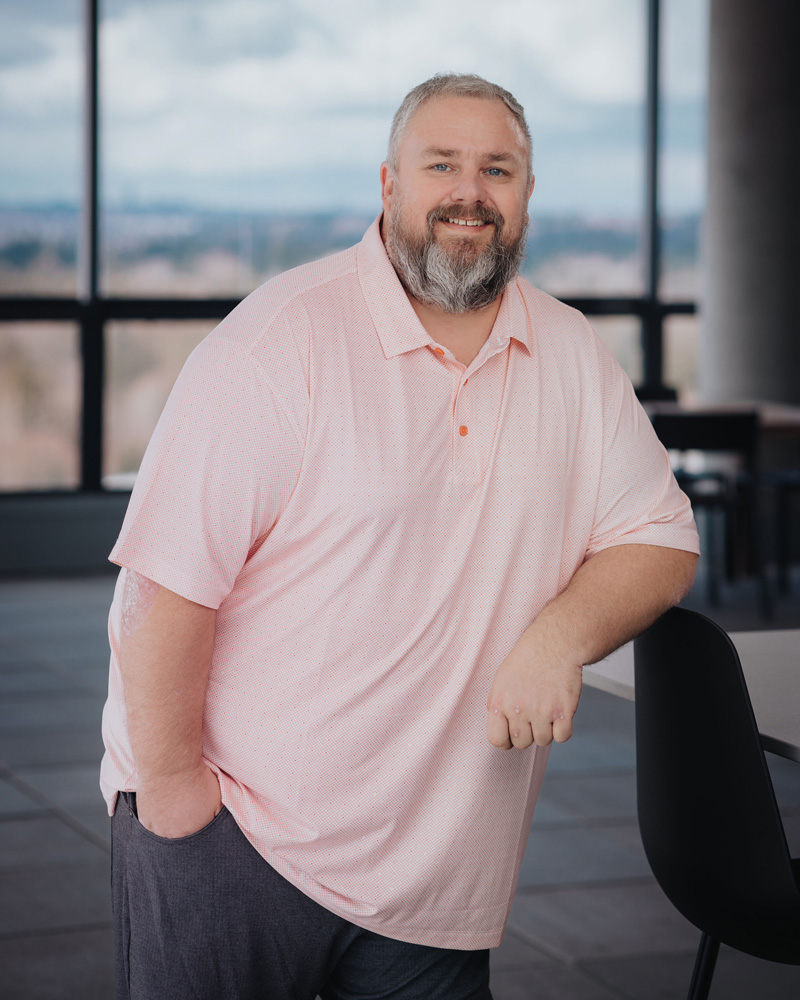 Professional headshot of Derrek Bennett