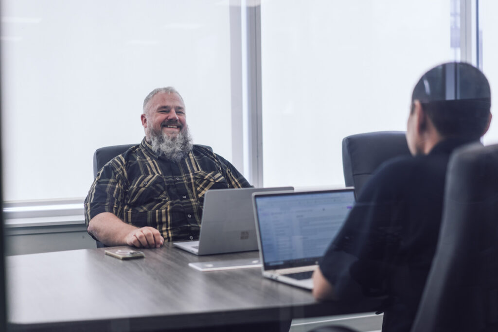 Two employees having a meeting in the boardroom