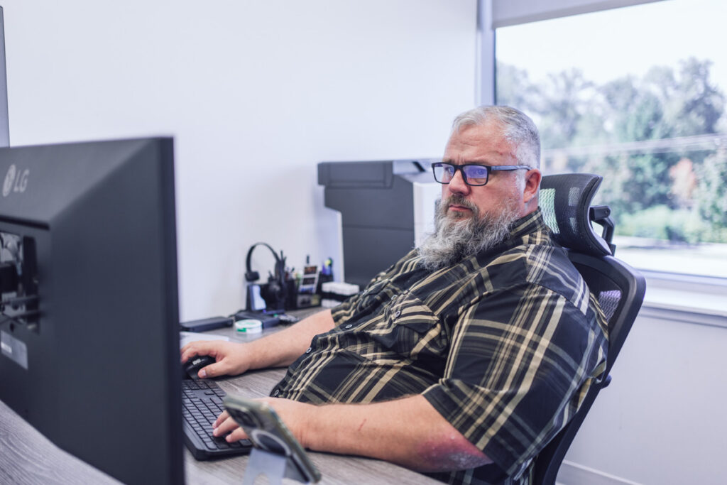 An employee working in their office