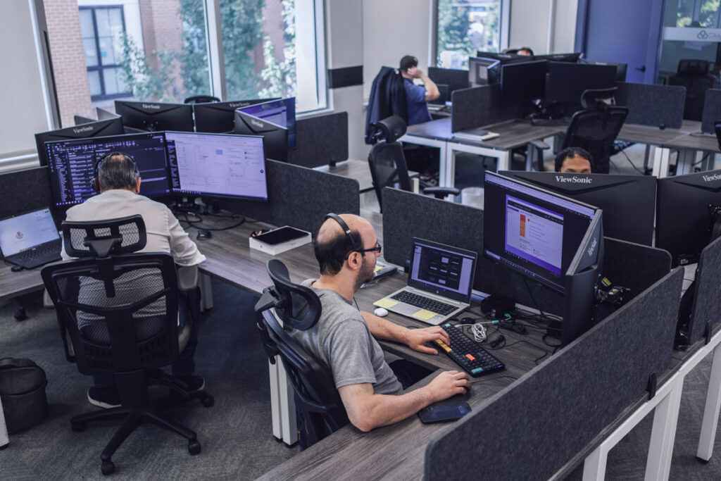 Coworkers sitting at their desks in the office